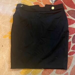 Express black  pencil skirt with gold accent buttons back zipper and slit.